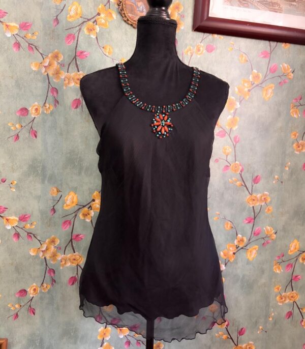 1000412189 Blusa negra translucida