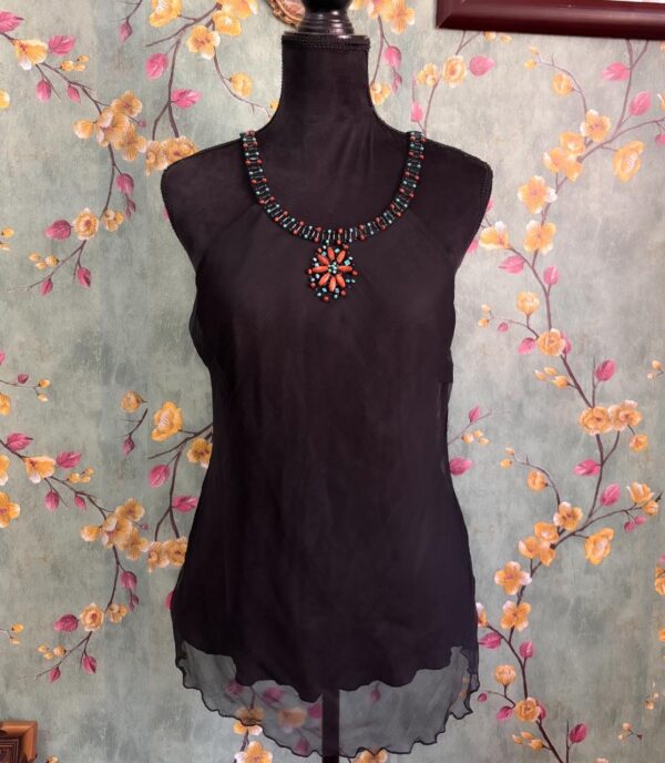 1000412195 Blusa negra translucida